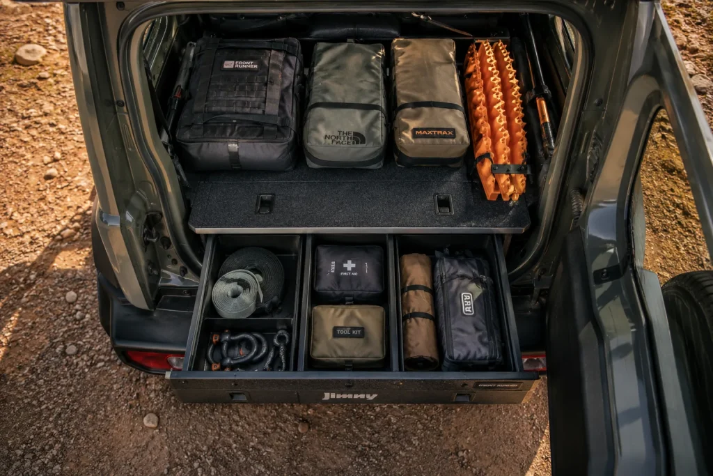 Neatly packed Suzuki Jimny boot with drawer system and recovery gear