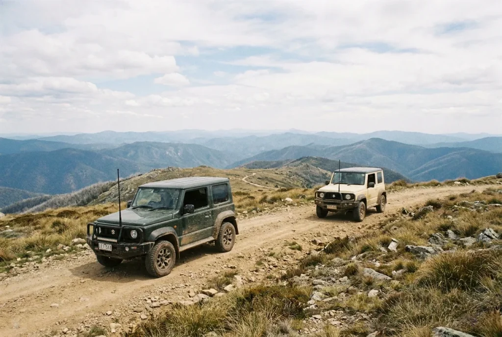 Two Jimnys in convoy on an exposed ridge track